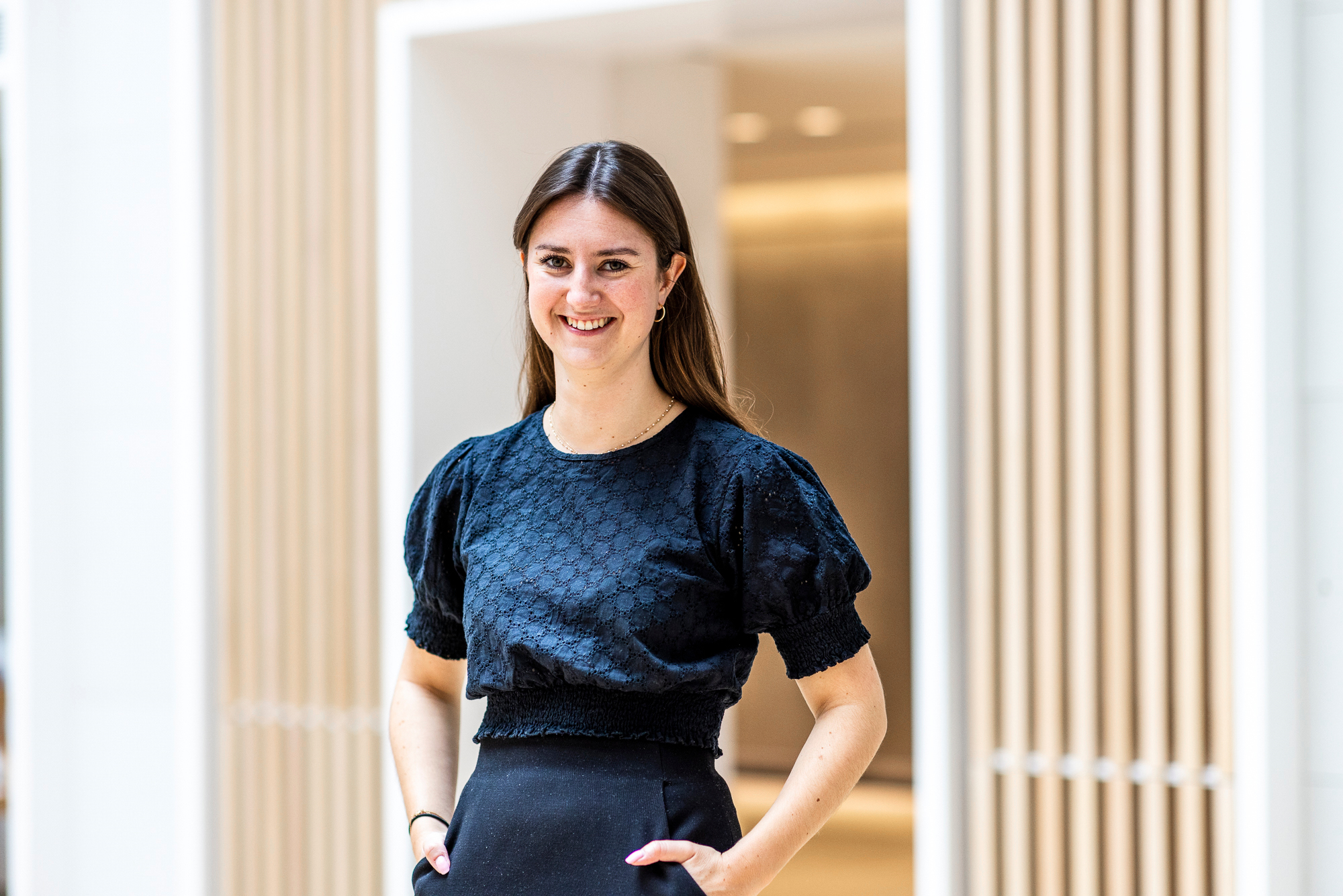 Female Lazard Colleague Smiling at Camera